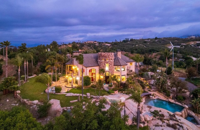 Castle on a hill, breathtaking views, surrounded with pools, trees, and lawn