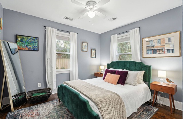Central pup-friendly ranch with vibrant interior, cozy deck & fenced backyard
