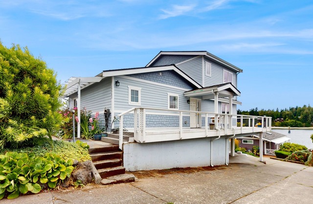 Centrally located waterfront home with ocean view, home office, grill, fireplace