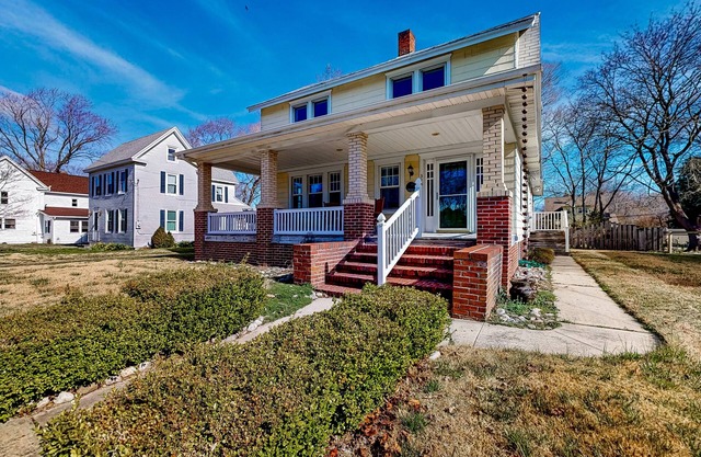 Century-old home with fenced yard, great front porch & small-town charm