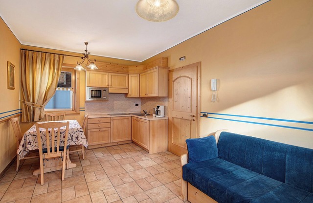 Chalet Betty Appartamento Pec mit Blick auf die Berge