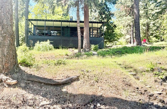 Charming 2-bedroom cabin with lake views offering a quiet, lake-side retreat.