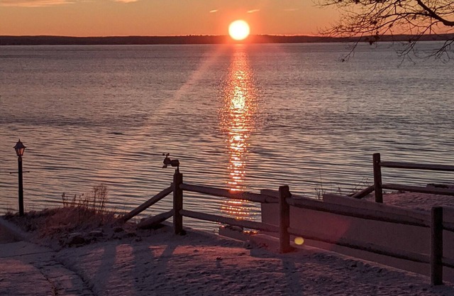 Charming 2-bedroom cabin sits on 2.5 acres on Hubbard Lake with WiFi access.
