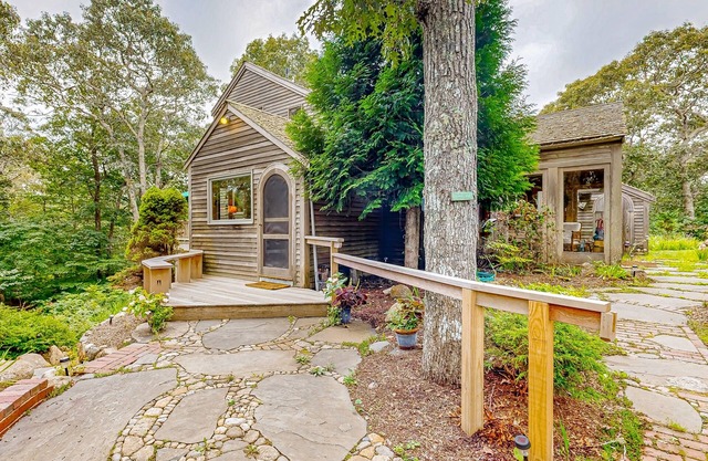 Charming 2-story house near the beach with inviting deck, large yard & canoe