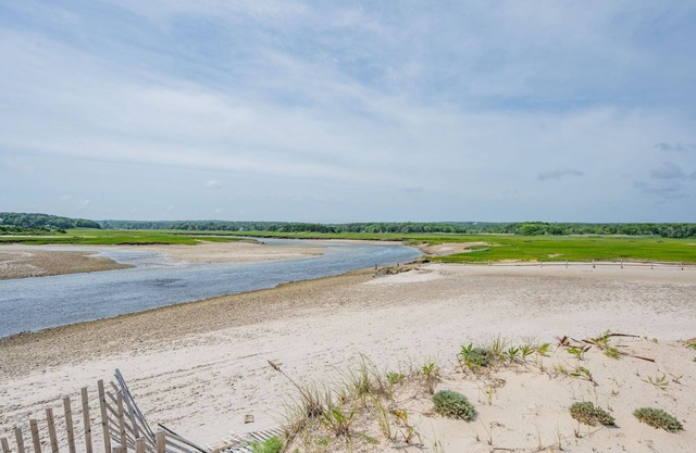 Charming 2 story cottage is located in exclusive Cape Shore Village overlooking Scorton Creek