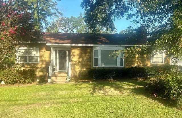 Charming 3-bedroom house with Spacious Backyard! Located in the hub of the city.