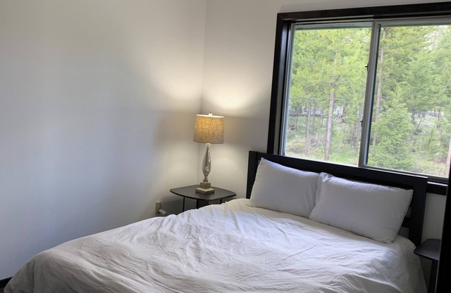Charming 3-bedroom house in enchanting Seeley Lake with WiFi in 6 acres .