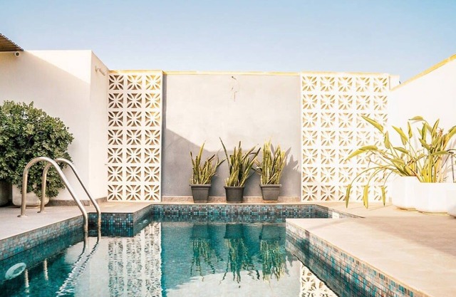A beautiful farmhouse with a rooftop pool