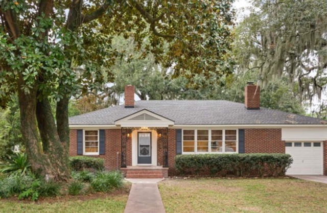 Charming bungalow near historic district with fenced yard, patio, & fireplaces