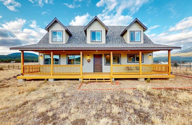 Mountain-view home with large deck, patio, grill, wood fireplace, W/D, & AC