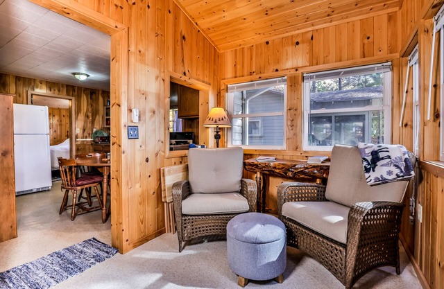 Charming, dog-friendly, lakefront cottage with boat dock, grill, & firepit