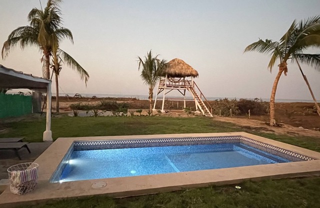 Charming entire home with pool and view tower. Few steps from the beach.