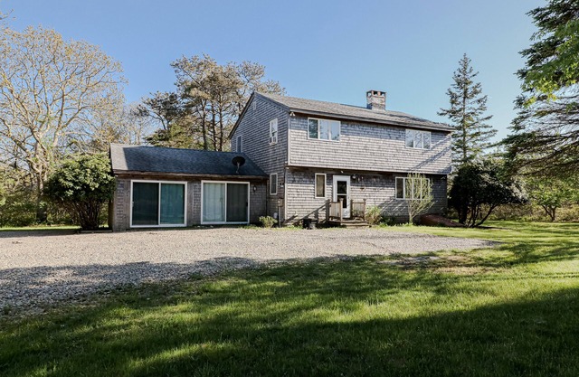 Charming forest retreat by the beach with grill, deck, & sprawling yard