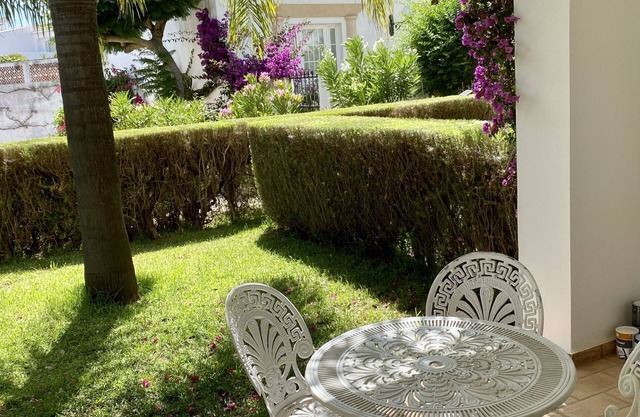 Charming garden apartment with generous verandah, 3 minutes walk from beach.