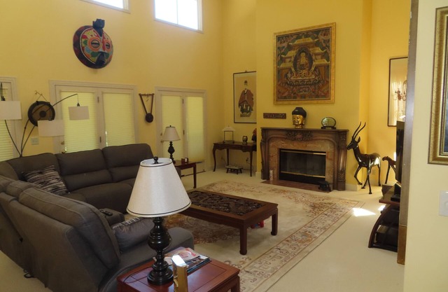 Charming quiet single story home amongst coast live oak trees in gated community