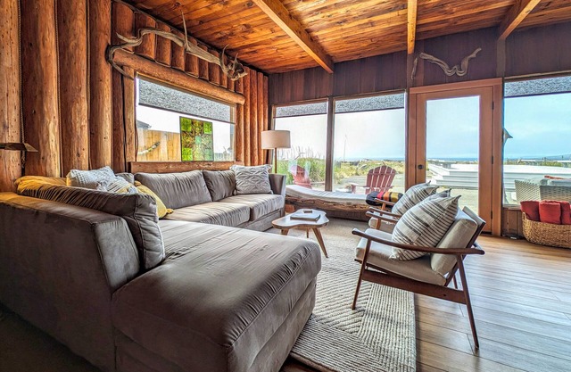 Charming water view retreat with a wood-burning fireplace, deck, grill, and W/D