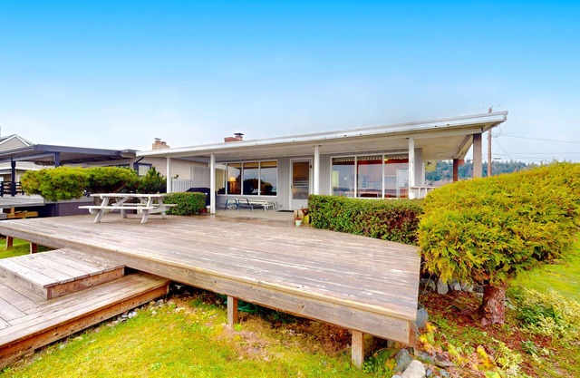 Charming waterfront home with expansive deck & gorgeous sunset views