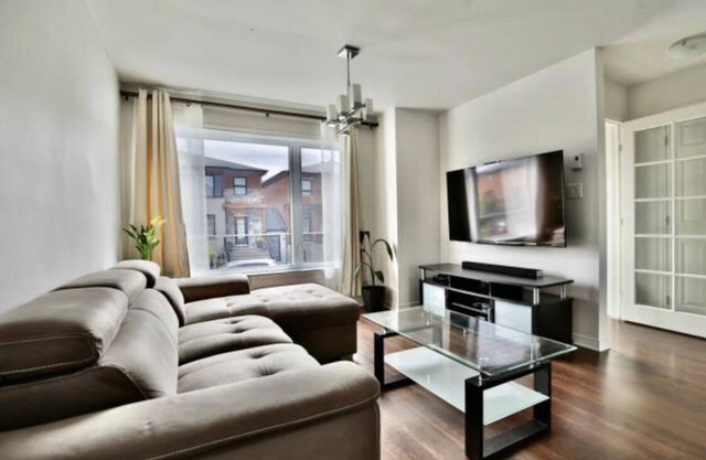 Chic Condo Comfort: Your Ideal Brossard Retreat Awaits