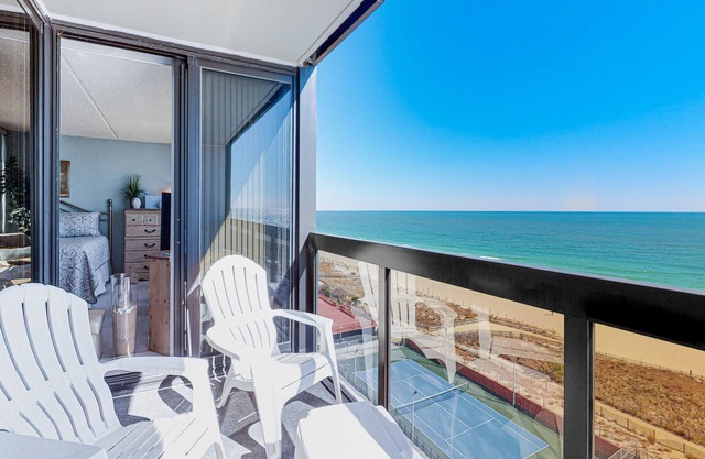 Classic beachfront condo with pools, beach bar, tennis & AC