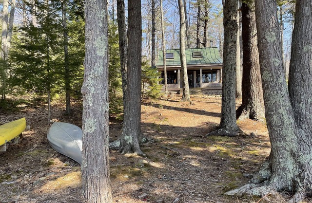Classic Maine Lake Cottage with two beaches on 8 private acres.