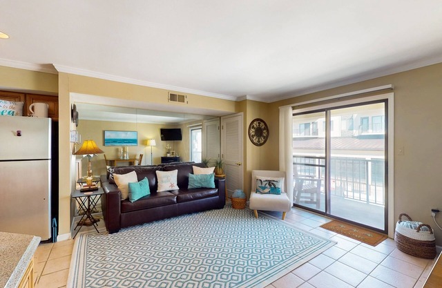 Coastal and Beachy Condo with Pool and Hot tub access - steps from beach