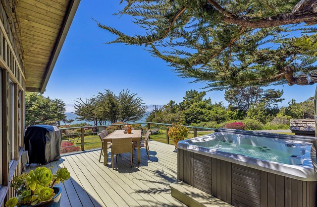 Coastal cliffside hideaway with yard, hot tub, & wood fireplace - dog-friendly
