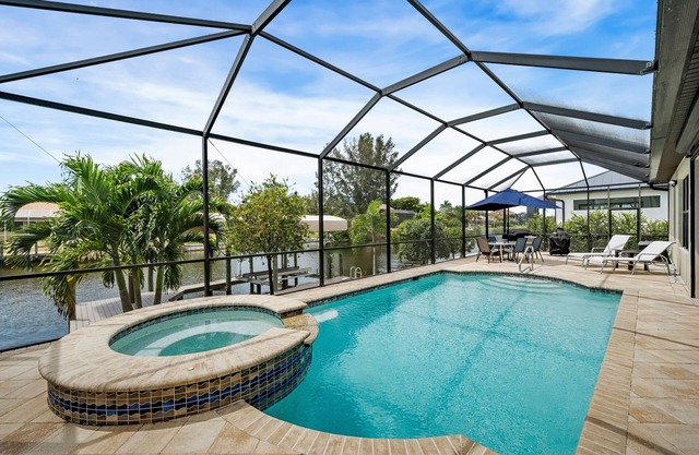 Come visit Boaters Delight in SW Cape-Large Pool/Spa home on canal w/ boatlift!