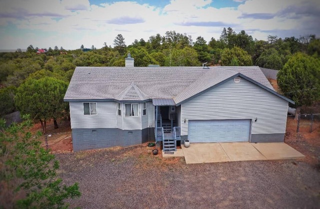 Comfortable home in the country just outside of Show Low. Space to park trailer.