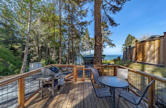 Comfy oceanside retreat, forested creekside setting, expansive grounds over ocean bluffs