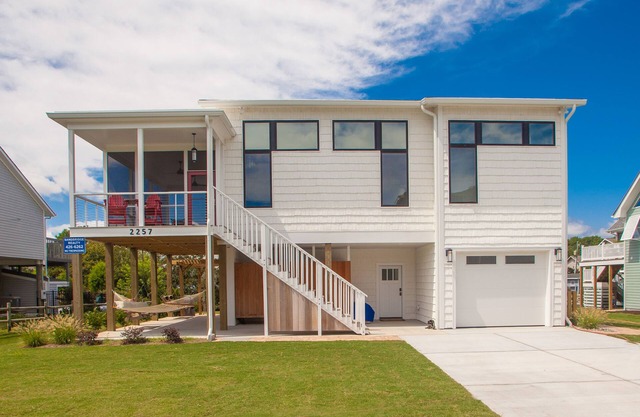 Contemporary home on canal w/elevator, dock, private washer/dryer, central AC