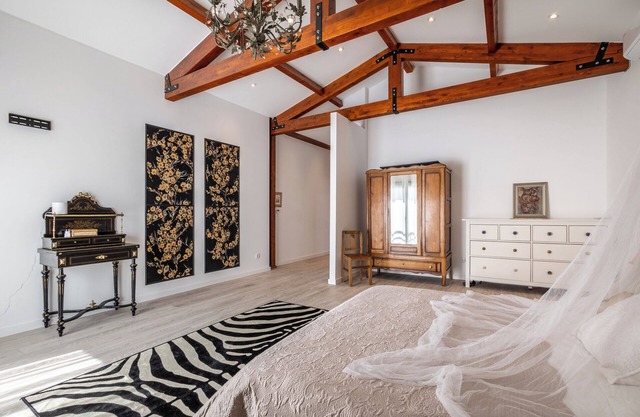Contemporary rural villa with large wooden beams with artistic accents