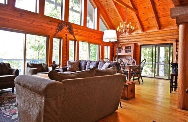 Cool off in the mountains! Enjoy a real log home with endless views .