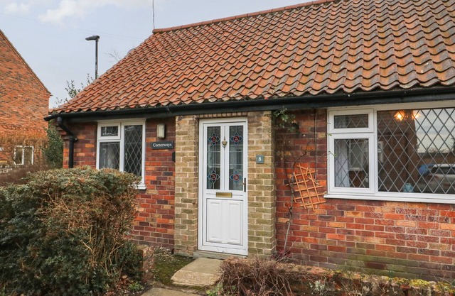 CORNERWAYS, 8 NORTH LANE, with a garden in Haxby