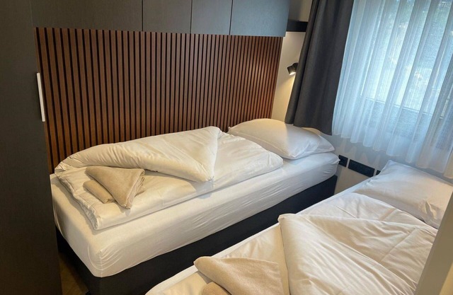 Angenehme Wohnung in einem Ferienhaus für 4 Leute mit W-LAN, TV, Terrasse und Parkplatz