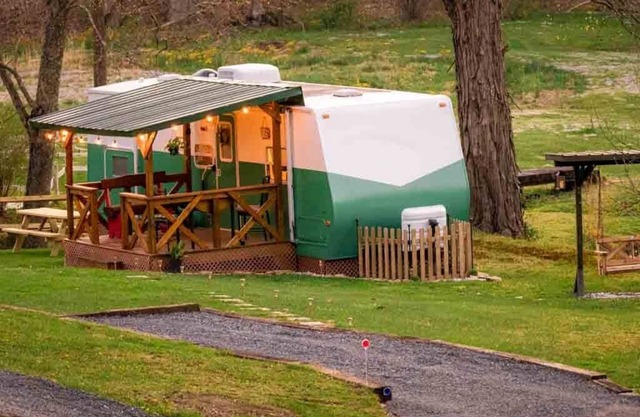 Cotch under a sugar maple tree w/ firepit, swing and outdoor shower
