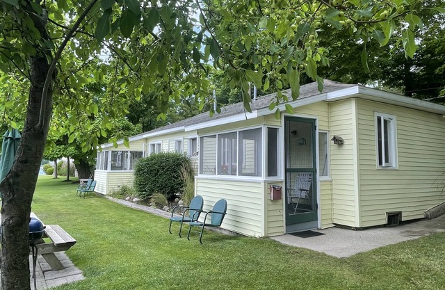 Cottage 1 is a charming 2 bedroom only 25’ from its boat dock & Hamlin lake.