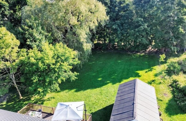 Cottage retreat in town! Spacious with large backyard.