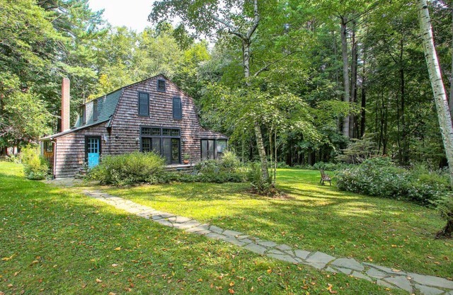Cottage-style home, beautiful landscaping, large screened porch, fire pit,...