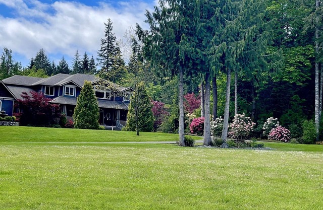 Country Estate on acreage with swimming pool, hot tub, creek and trails.