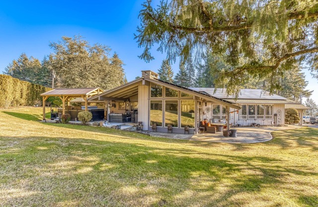 Countryside home with private swim spa, fire pit, spacious kitchen, & game room