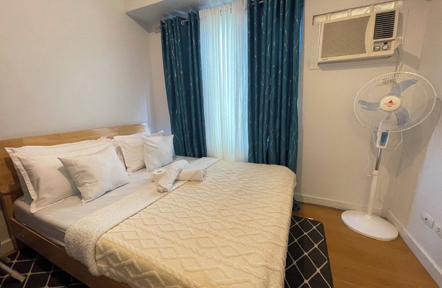 Cozy 1-bedroom condo with fitness room and AC in beautiful Manila