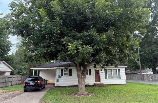 Cozy 3-Bedroom Cottage with Carport & Shaded Yard. Nestled under a big tree.