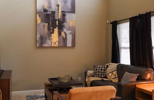 Cozy 3 BR home w/ high ceilings and hot tub.