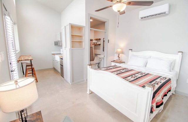 Cozy cabin with queen bed, full kitchen, and refreshing walk-in shower.
