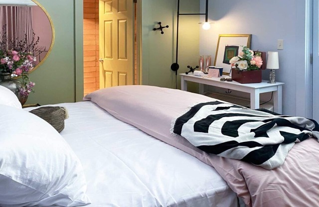 Cozy Carriage House room with a double bed and private balcony