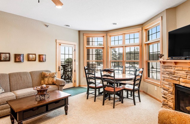 Cozy condo w/ lake-view, balcony, fireplace, pool, game room, & washer/dryer