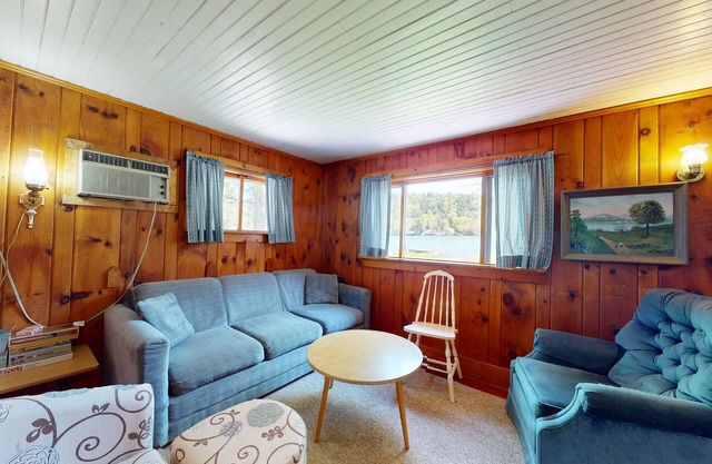 Cozy cottage w/ waterfront, beach, dock, lake views, playground, kayaks, and A/C