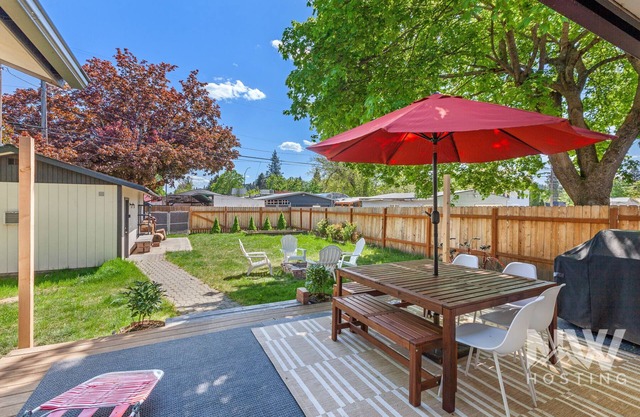 Cozy Downtown Bungalow—Fire Pit, Spacious Deck, Fenced Yard & Walk to Local Dining, Bars & Shops!