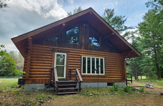 cozy lake house, full log cabin on beautiful shell lake, w/ wonderful loft.