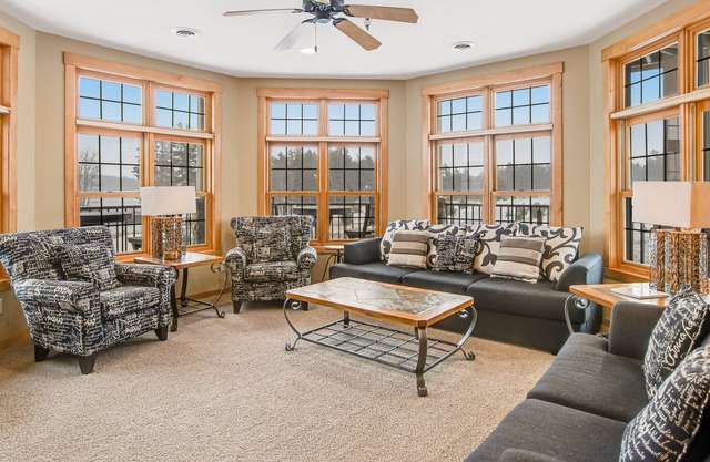 Cozy lakefront condo with balcony, fireplace, AC, indoor pool, gym, & hot tubs